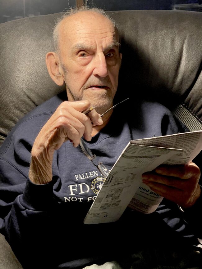 Rudolph Orisich in chair